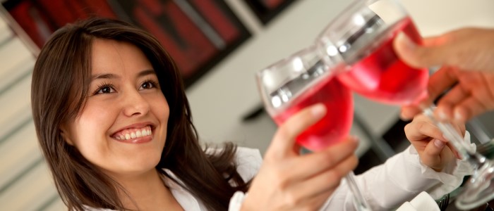 young woman toasting with red wine