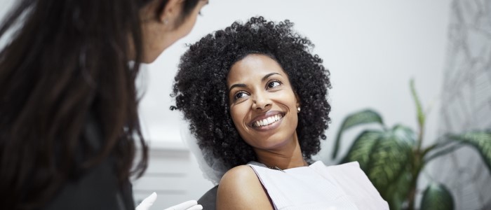 female dental patient sitting in the dentist's chair